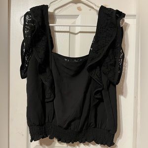 Haute Monde Black Top with black see-through raffles. No sleeves.